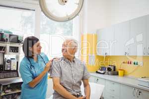 Female doctor and patient interacting with each other
