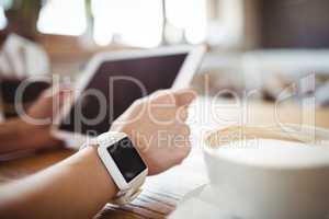 Hands of woman using digital tablet