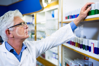 Pharmacist checking medicines in pharmacy