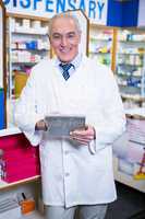 Pharmacist using a digital tablet