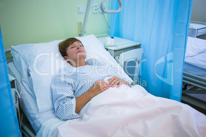 Senior patient lying on a bed