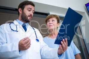 Doctor and patient discussing over report
