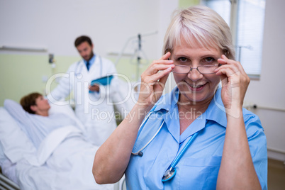Portrait of smiling nurse wearing spectacle