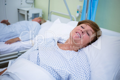 Senior patient lying on a bed