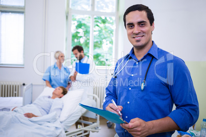 Smiling doctor holding a medical report