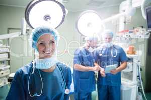 Portrait of smiling female surgeon standing in operation room