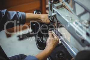 Shoemaker using sewing machine