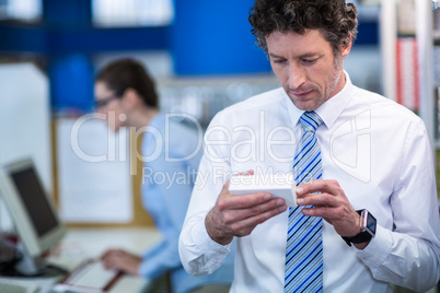 Pharmacist checking a medicine box