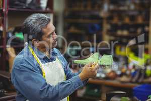 Shoemaker marking on shoe last with pen