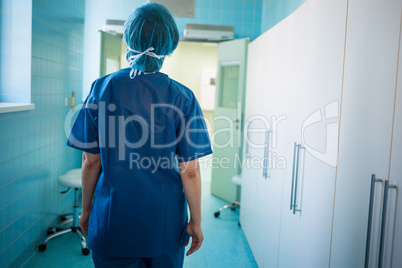 Surgeon standing in corridor at hospital Surgeon standing in corridor at hospital