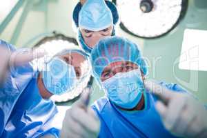 Surgeons performing operation in operation room