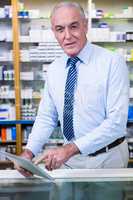 Pharmacist using a digital tablet
