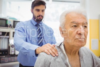 Male doctor examining a patient