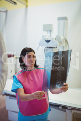 Female doctor examining x-ray