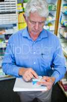 Pharmacist checking medicines