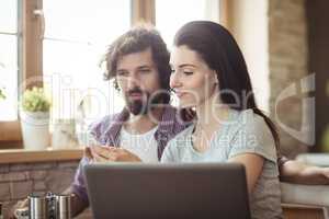 Couple using mobile phone