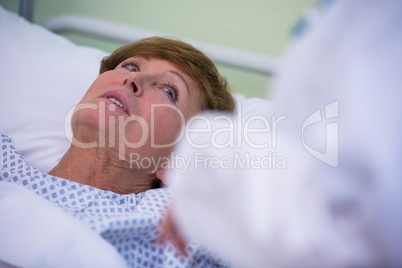 Senior patient lying on a bed