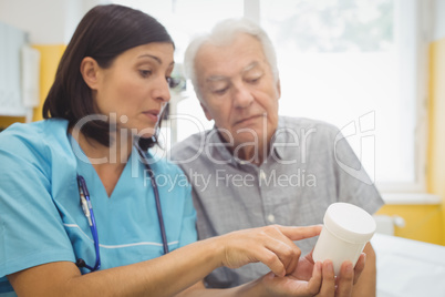 Doctor explaining medicine to his patient