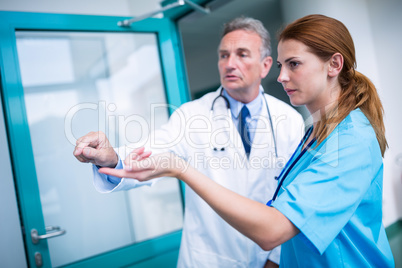 Doctor and surgeon discussing with each other