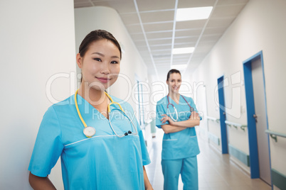 Nurses standing in hospital corridor
