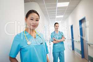 Nurses standing in hospital corridor