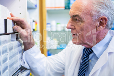 Pharmacist checking medicines