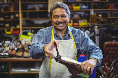 Shoemaker repairing a shoe