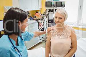 Female doctor consoling a patient