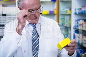 Pharmacist checking medicines