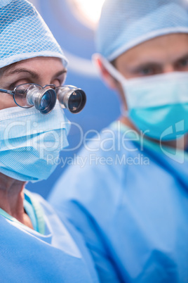 Surgeon looking through surgical loupes in operation room