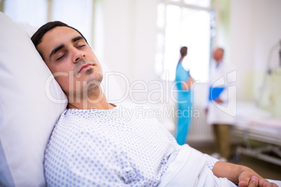 Close-up of patient sleeping on bed