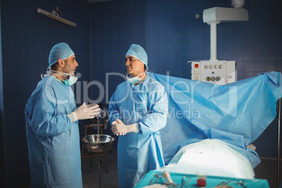 Surgeons interacting with each other in the operation room