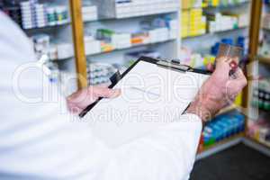 Pharmacist checking medicines