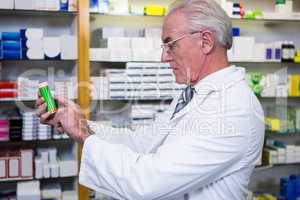 Pharmacist checking medicines