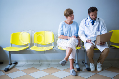 Doctor and patient discussing over laptop