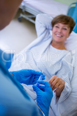 Nurse giving an injection to a patient