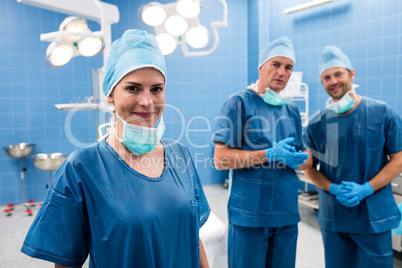 Portrait of surgeons smiling in operation room