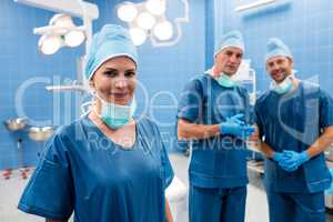 Portrait of surgeons smiling in operation room