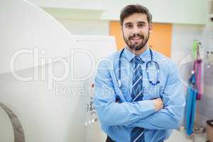 Portrait of doctor standing near mri scanner