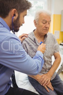 Male doctor examining a patient