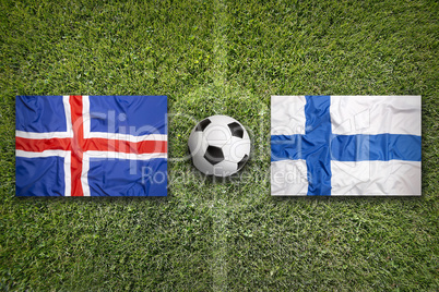 Iceland and Finland flags on soccer field