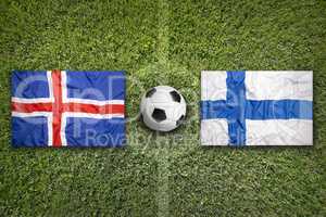 Iceland and Finland flags on soccer field
