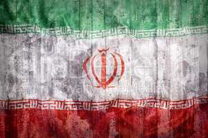 Grunge style of Iran flag on a brick wall
