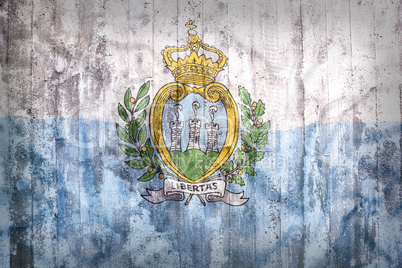 Grunge style of San Marino flag on a brick wall