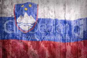 Grunge style of Slovenia flag on a brick wall