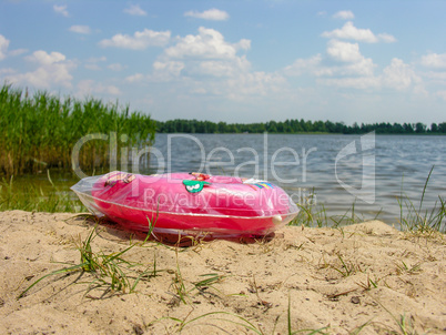 Children's inflatable circle on a sandy beach