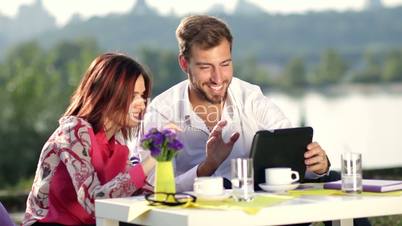 Businesspeople having online meeting using tablet