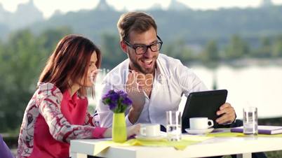 Confident businessman talking online using tablet