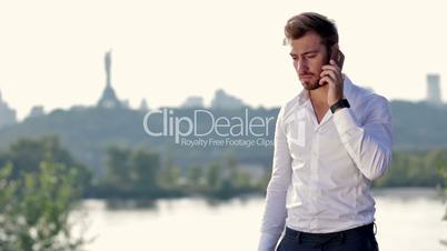 Angry businessman shouting on the phone