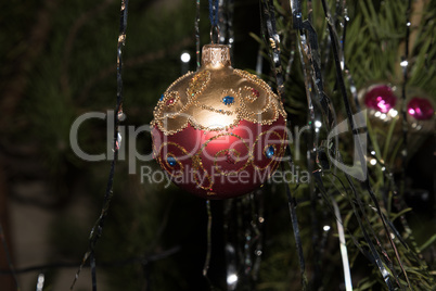 Christmas toy ball red with gold.